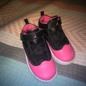 Jordan’s. Size 9 in toddler/small child sizes. Pink and black